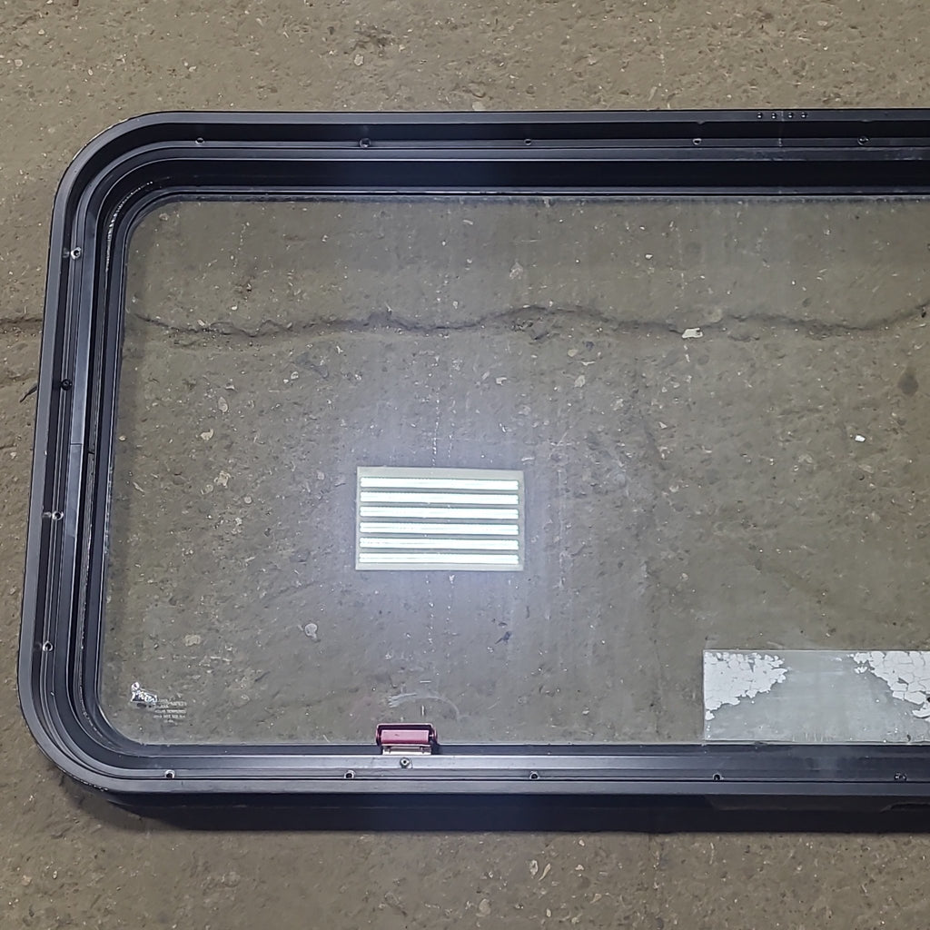 Used Black Radius Emergency Opening Window : 48 1/2" W x 22" H x 1 3/4" D - Young Farts RV Parts