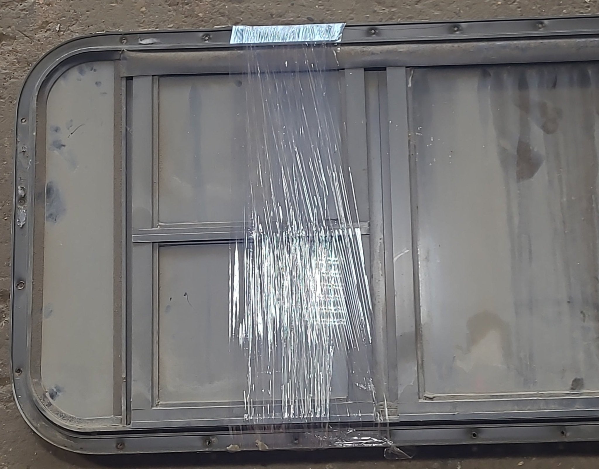 Used Black Radius Emergency Opening Window : 49 3/4" W x 19 1/2" H x 1 7/8" D - Young Farts RV Parts