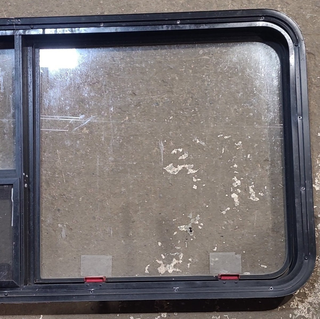 Used Black Radius Emergency Opening Window : 53 1/2" W x 25 1/2" H x 1 7/8" D - Young Farts RV Parts