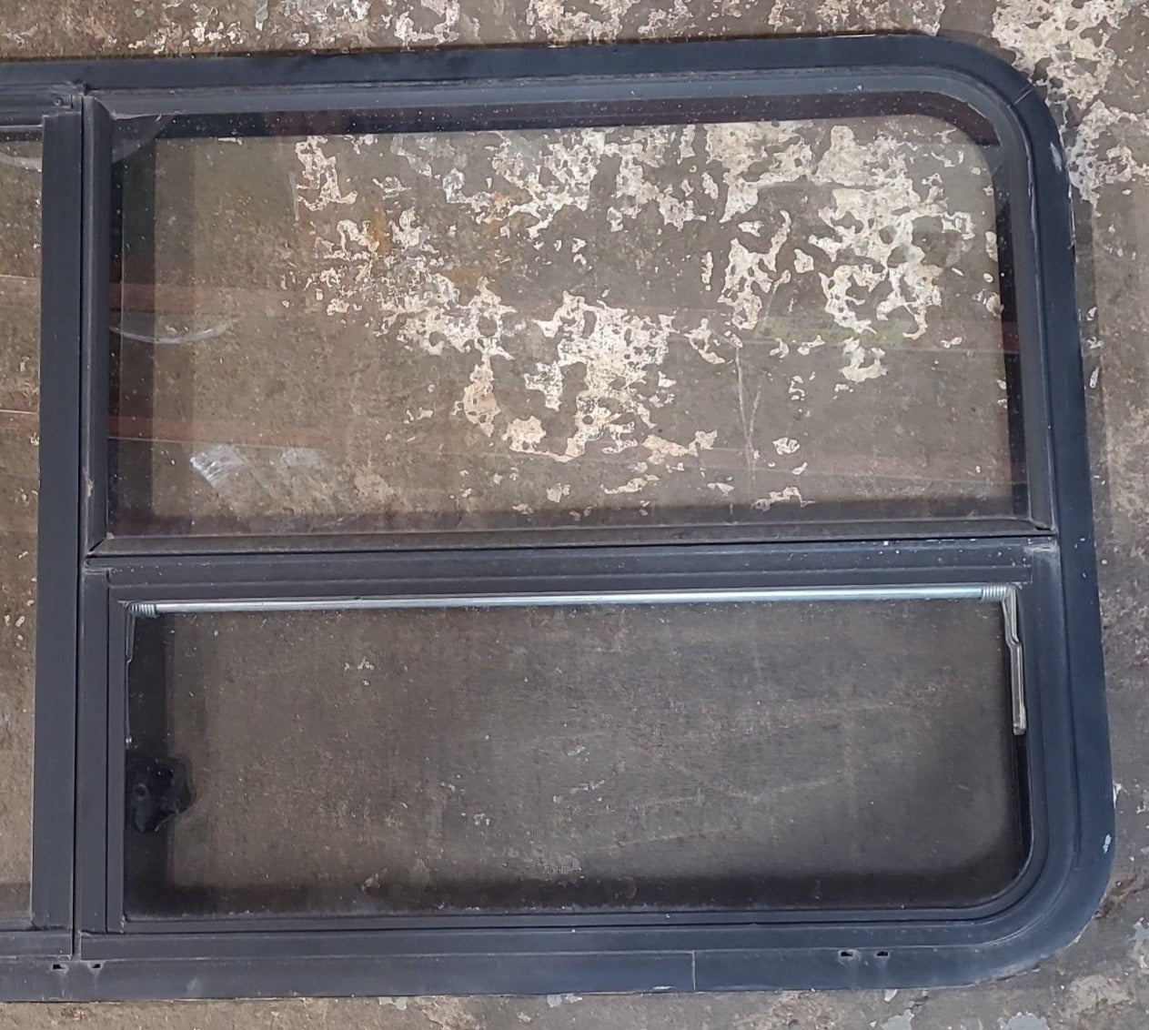 Used Black Radius Emergency Opening Window : 53 1/2" W x 25 1/2" H x 1 7/8" D - Young Farts RV Parts