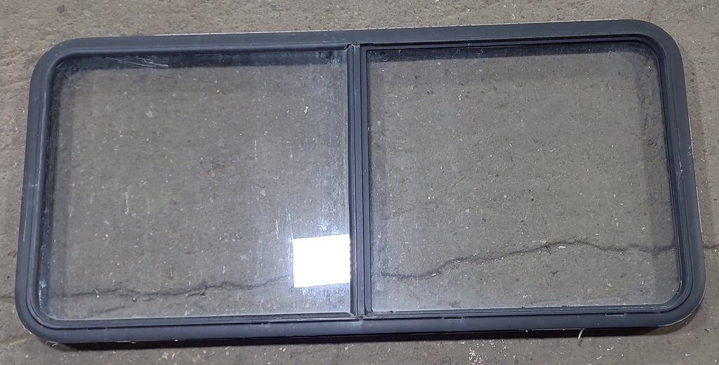 Used Black Radius Emergency Opening Window : 55 1/2" W x 25 1/2" H x 1 7/8" D - Young Farts RV Parts