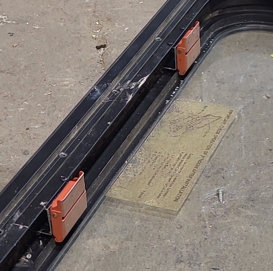 Used Black Radius Emergency Opening Window : 59 1/2" W x 21 1/2" H x 1 7/8" D - Young Farts RV Parts