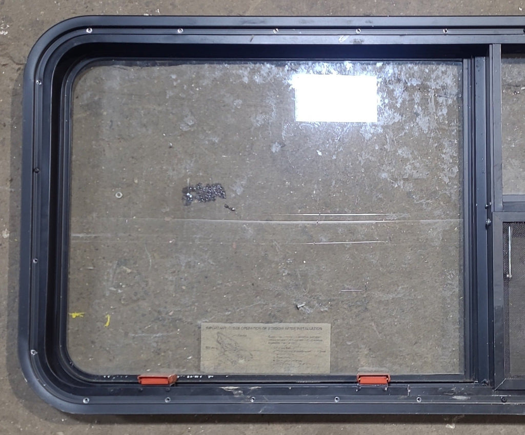 Used Black Radius Emergency Opening Window : 59 1/2" W x 21 1/2" H x 1 7/8" D - Young Farts RV Parts