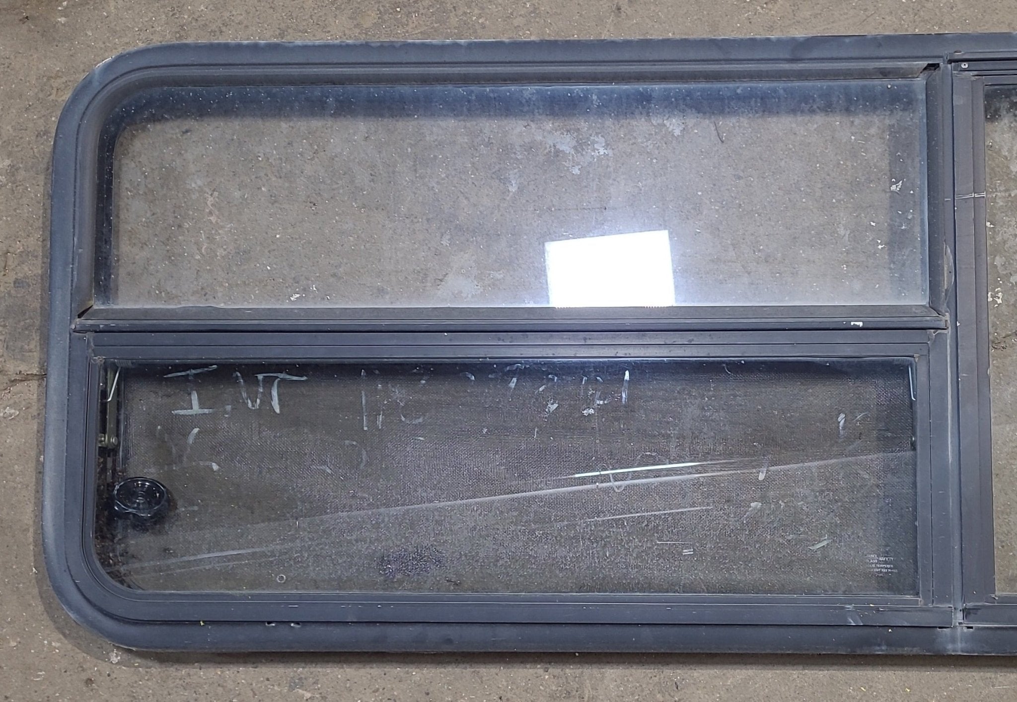 Used Black Radius Emergency Opening Window : 59 1/2" W x 21 1/2" H x 1 7/8" D - Young Farts RV Parts