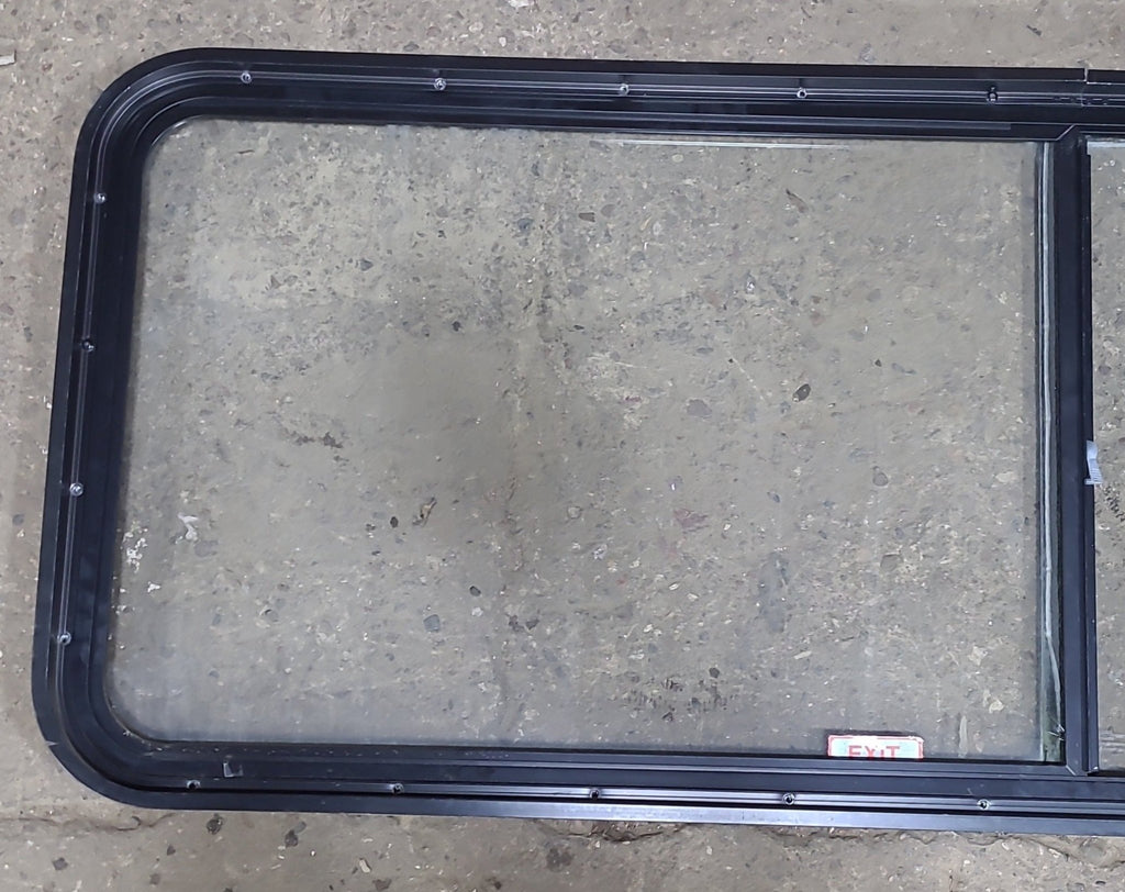 Used Black Radius Emergency Opening Window : 60 1/4" W x 21 3/4" H x 1 7/8" D - Young Farts RV Parts