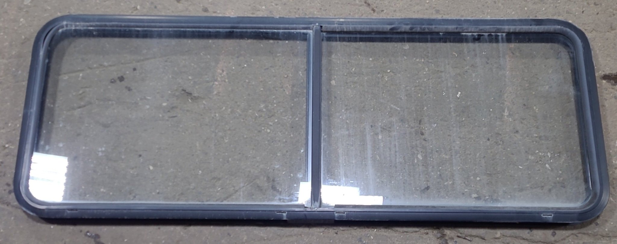 Used Black Radius Emergency Opening Window : 60 1/4" W x 21 3/4" H x 1 7/8" D - Young Farts RV Parts