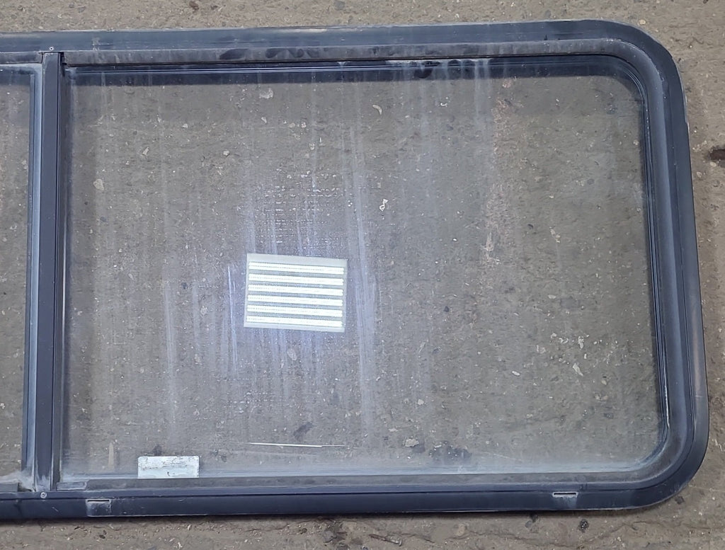 Used Black Radius Emergency Opening Window : 60 1/4" W x 21 3/4" H x 1 7/8" D - Young Farts RV Parts