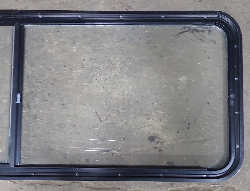 Used Black Radius Emergency Opening Window : 60 1/4" W x 21 3/4" H x 1 7/8" D - Young Farts RV Parts