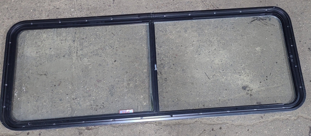 Used Black Radius Emergency Opening Window : 60 1/4" W x 21 3/4" H x 1 7/8" D - Young Farts RV Parts