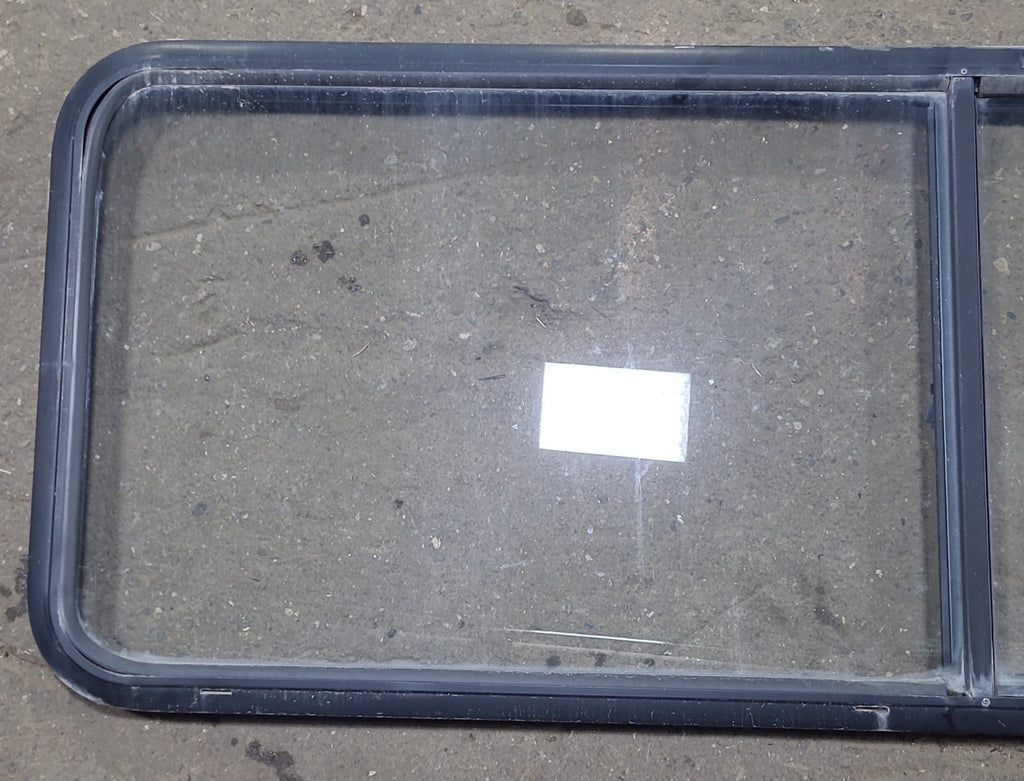 Used Black Radius Emergency Opening Window : 60 1/4" W x 21 3/4" H x 1 7/8" D - Young Farts RV Parts