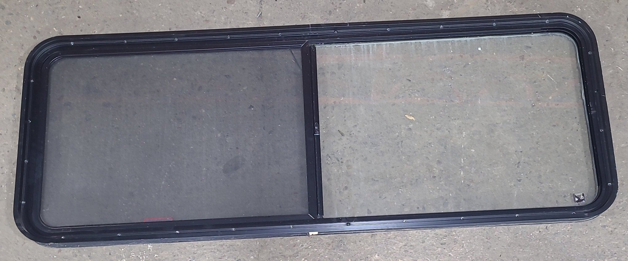 Used Black Radius Emergency Opening Window : 60 3/8" W x 21 3/4" H x 1 3/4" D - Young Farts RV Parts