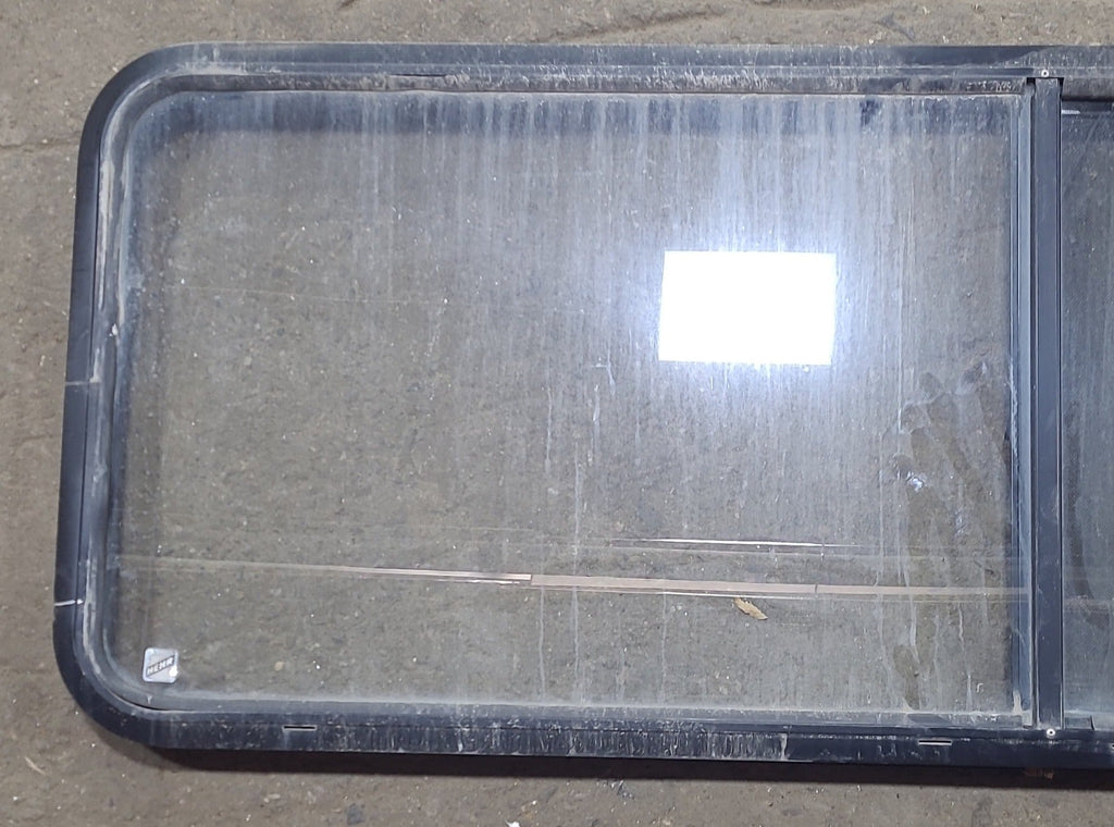 Used Black Radius Emergency Opening Window : 60 3/8" W x 21 3/4" H x 1 3/4" D - Young Farts RV Parts