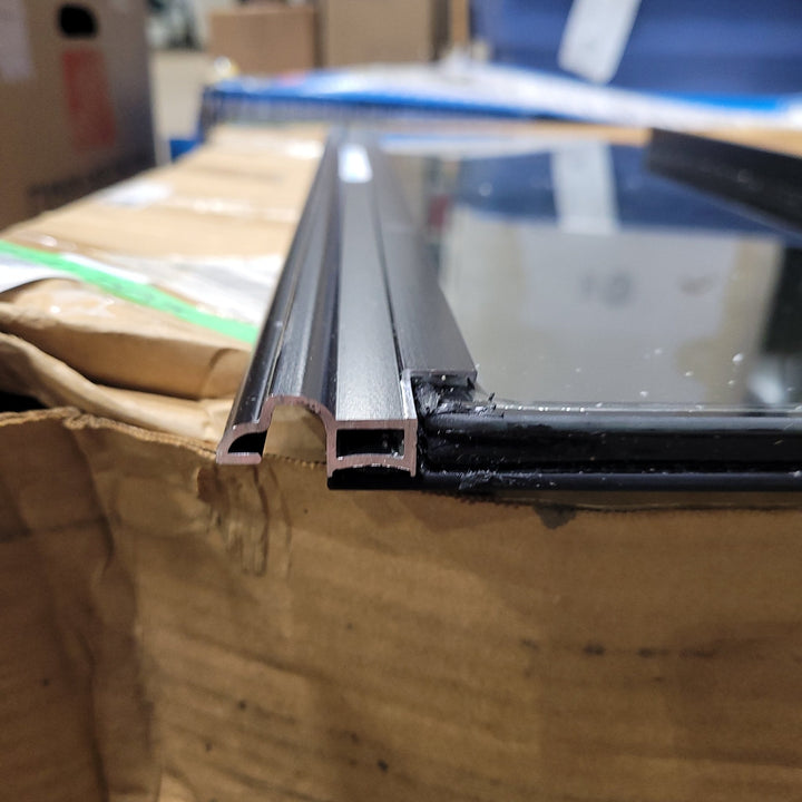 Used Black Radius Frameless Opening Window : 24 1/2" X 10 1/2" X 1/2" D - Young Farts RV Parts