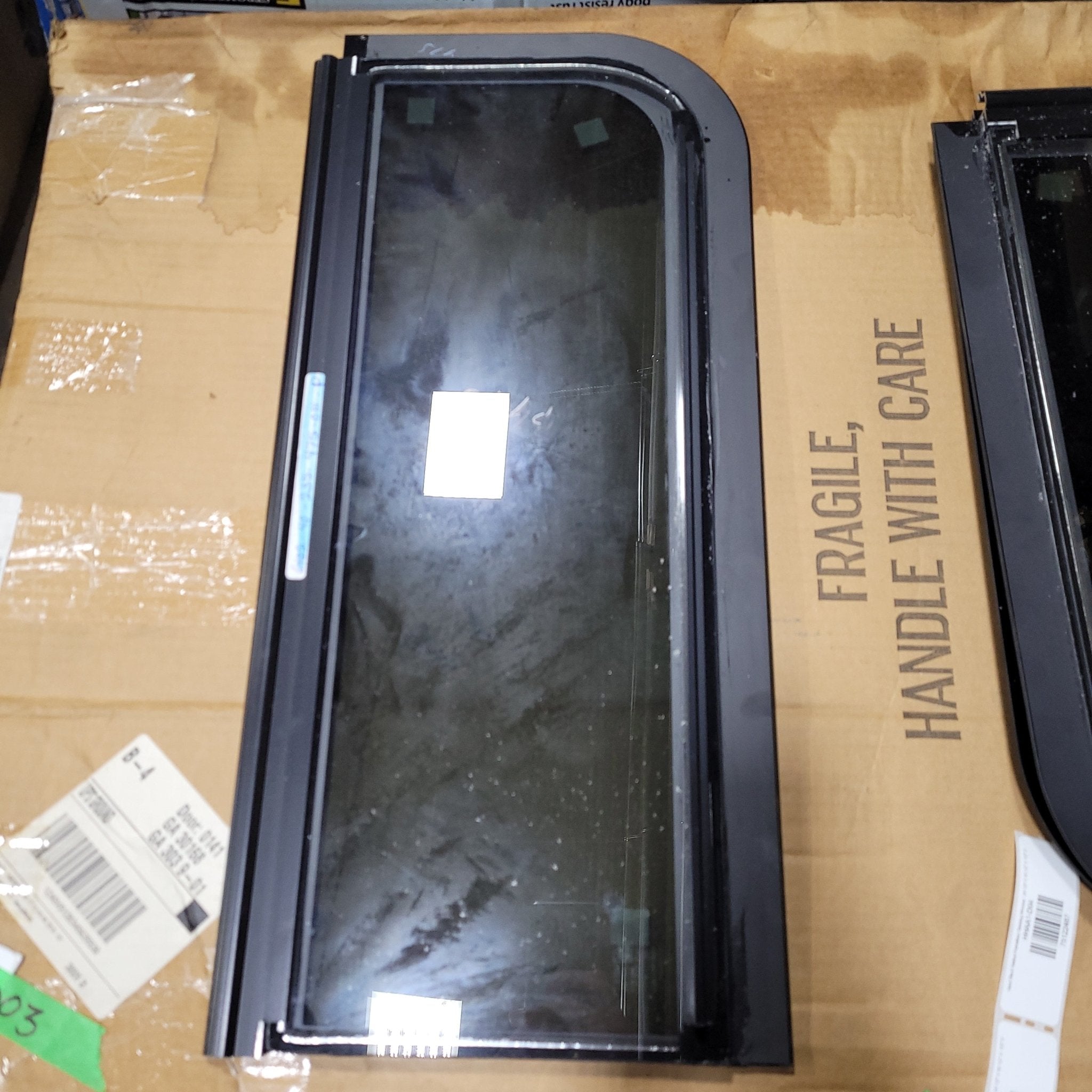 Used Black Radius Frameless Opening Window : 24 1/2" X 10 1/2" X 1/2" D - Young Farts RV Parts