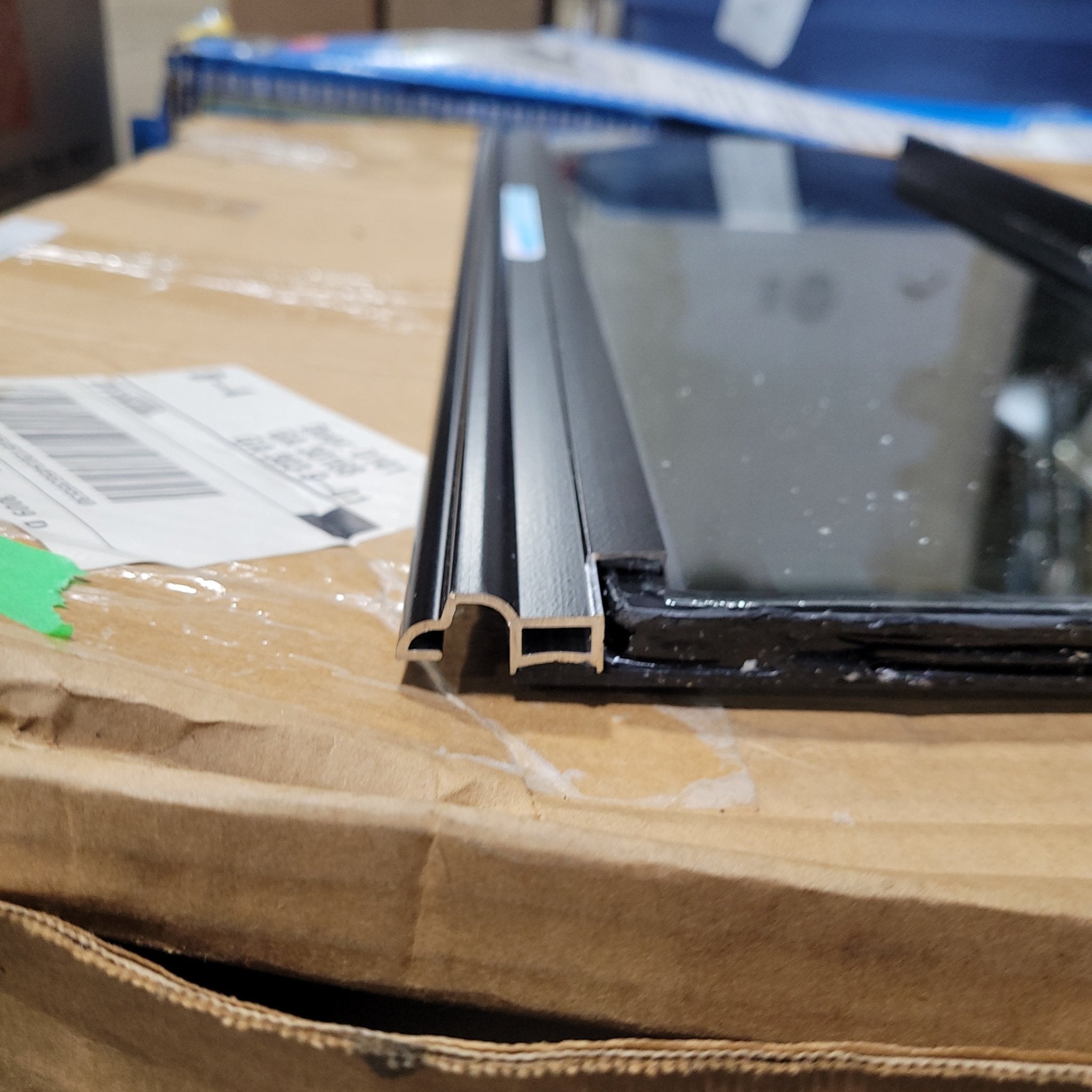 Used Black Radius Frameless Opening Window : 24 1/2" X 10 1/2" X 1/2" D - Young Farts RV Parts