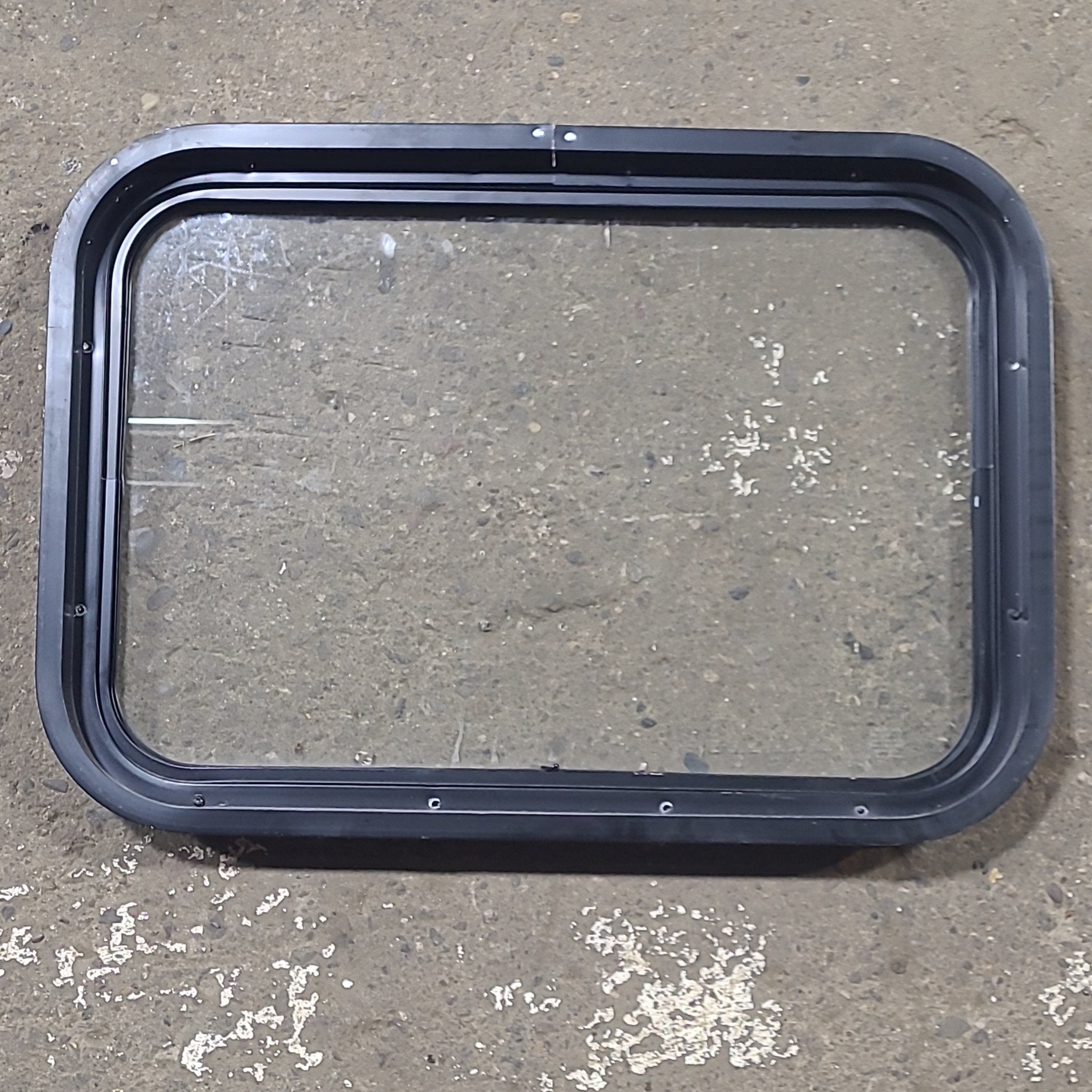 Used Black Radius Non Opening Window : 24 1/4" W x 16 3/4" H x 1 7/8" D - Young Farts RV Parts