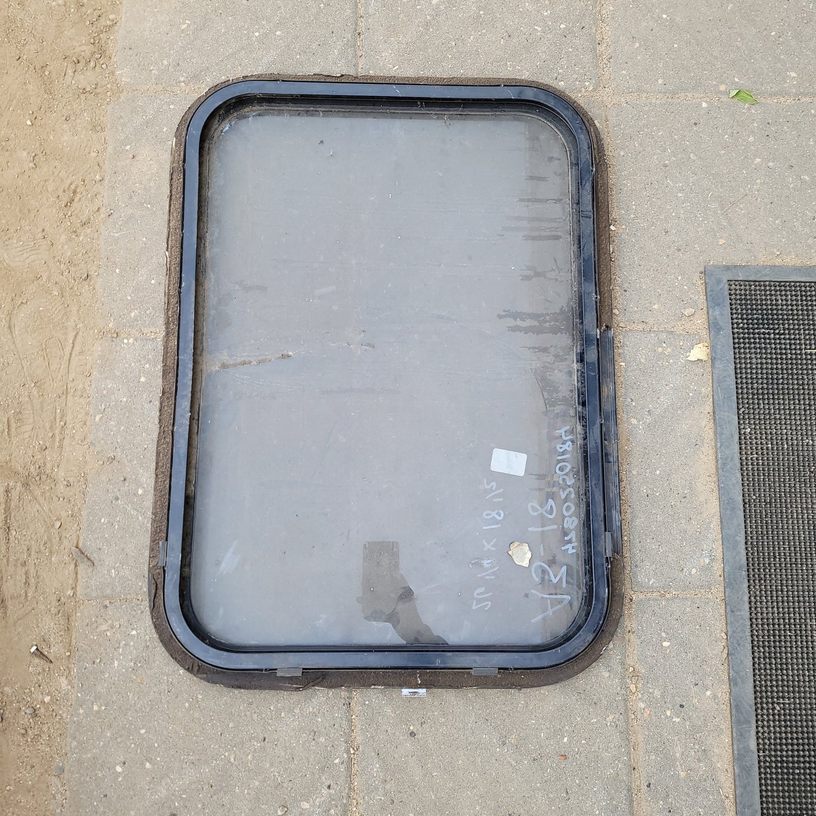 Used Black Radius Non- Opening Window : 26 1/4 X 18 1/2 X 1 1/2