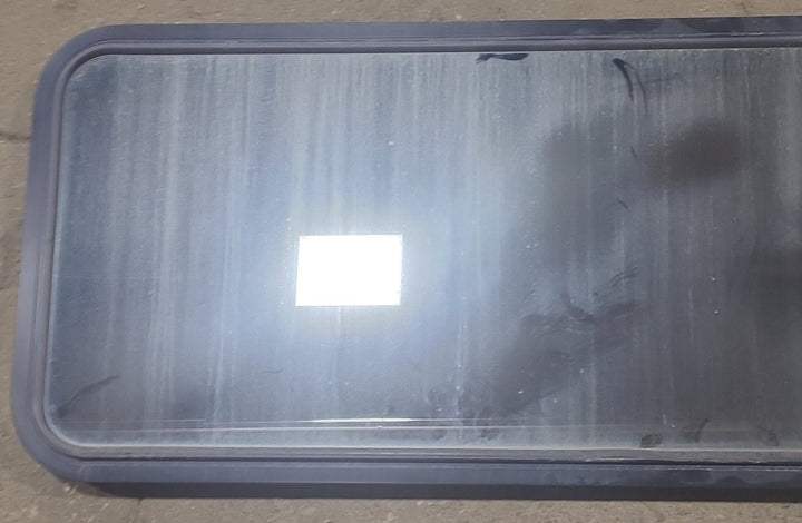 Used Black Radius Non Opening Window : 60 1/2" W x 21 3/4" H x 1 7/8" D - Young Farts RV Parts
