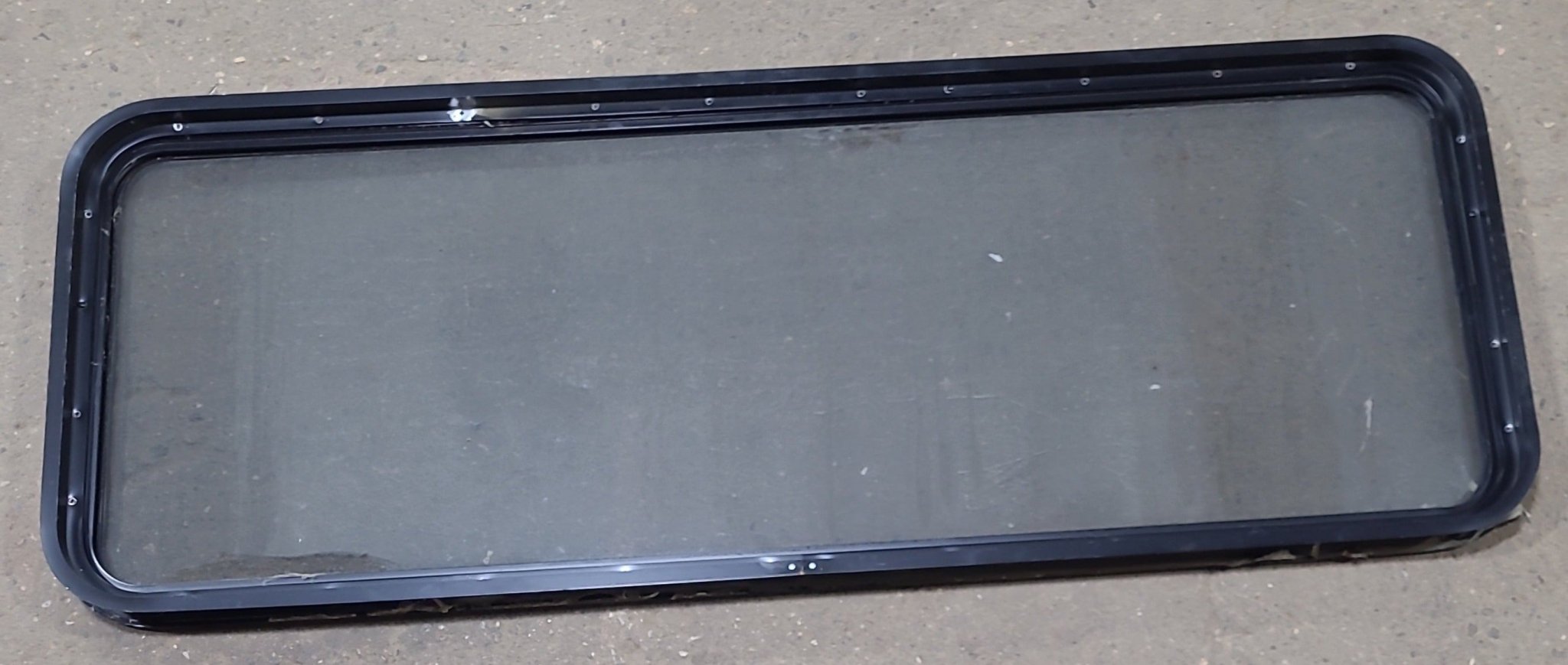 Used Black Radius Non Opening Window : 60 1/4" W x 21 3/4" H x 1 3/4" D - Young Farts RV Parts