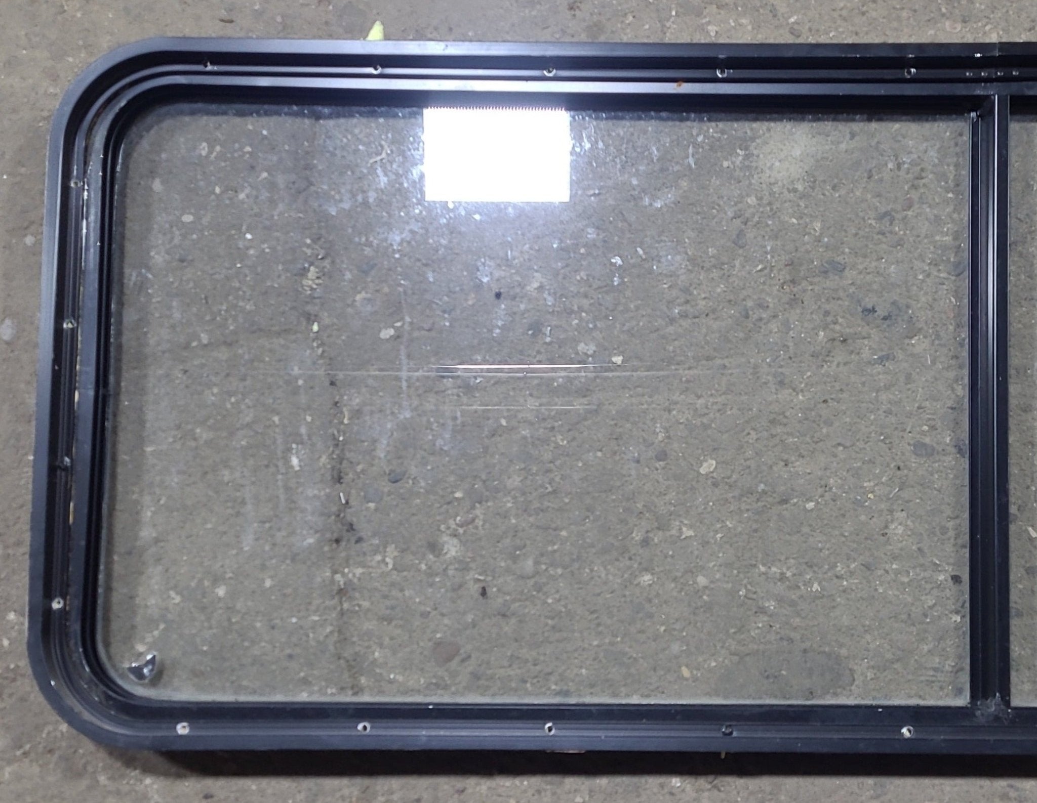 Used Black Radius Non Opening Window : 60 1/4" W x 21 3/4" H x 1 3/4" D - Young Farts RV Parts