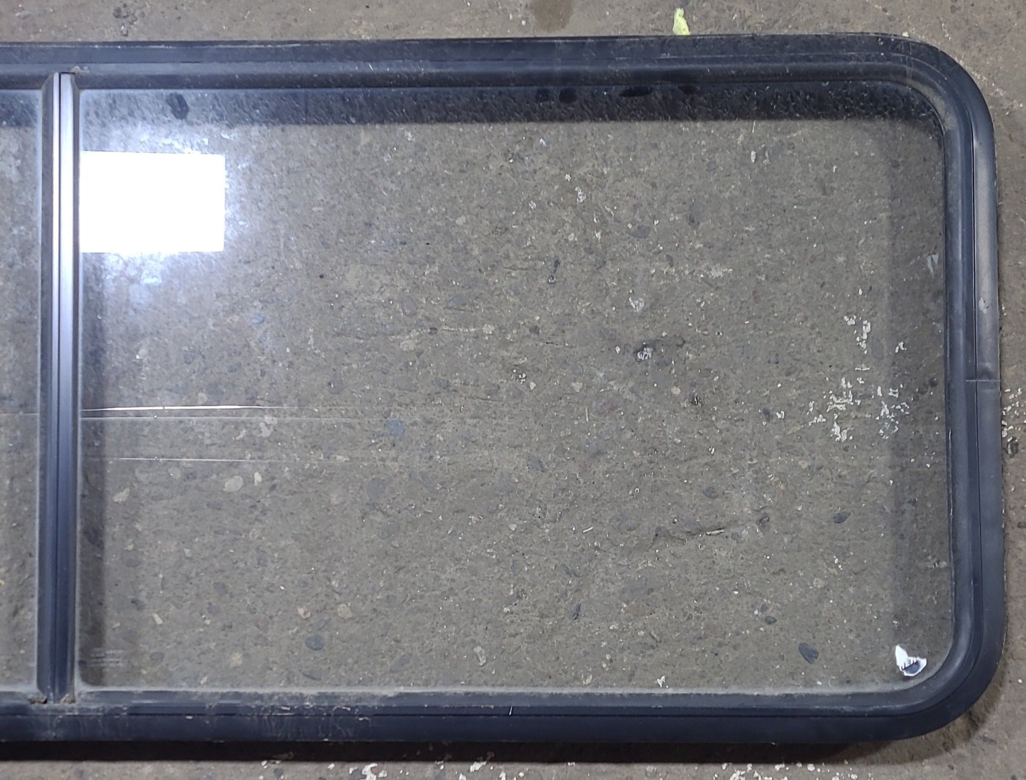 Used Black Radius Non Opening Window : 60 1/4" W x 21 3/4" H x 1 3/4" D - Young Farts RV Parts