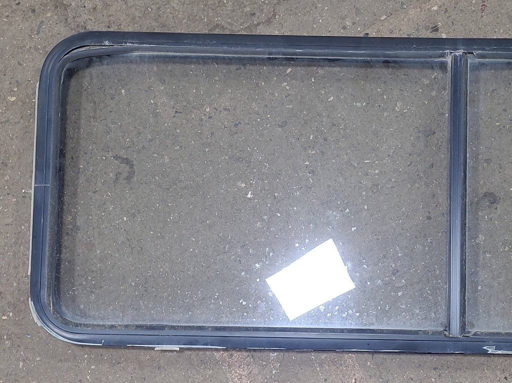 Used Black Radius Non-Opening Window : 60 1/4" W X 21 3/4" H X 1 5/8" D - Young Farts RV Parts