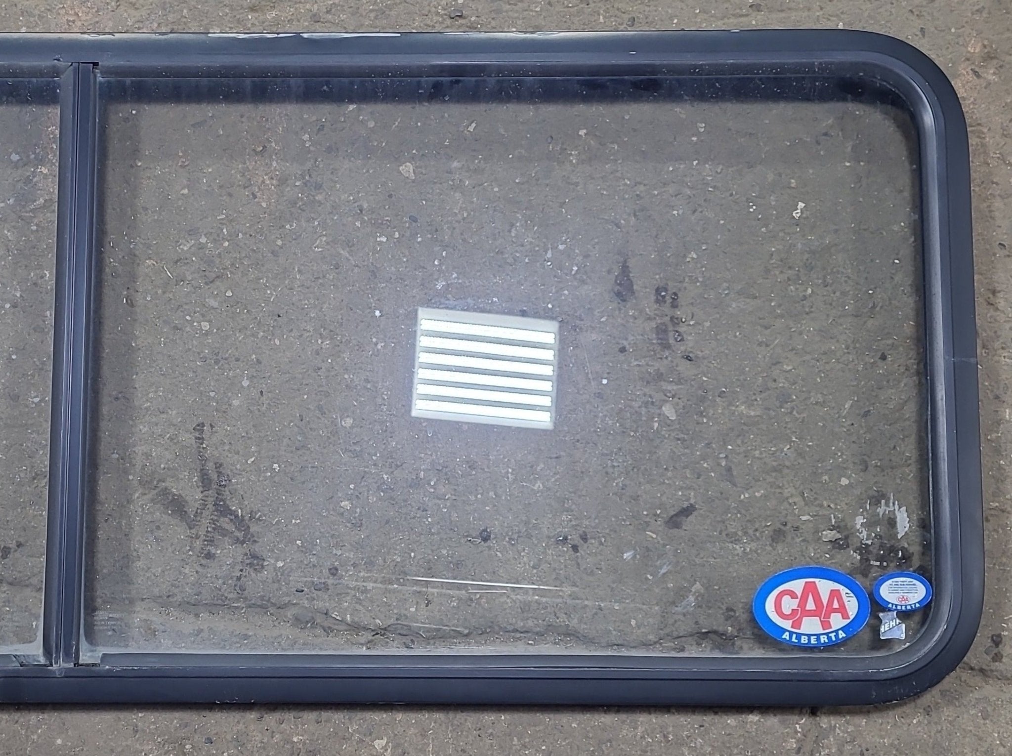 Used Black Radius Non Opening Window : 60 1/4" W x 21 3/4" H x 1 7/8" D - Young Farts RV Parts