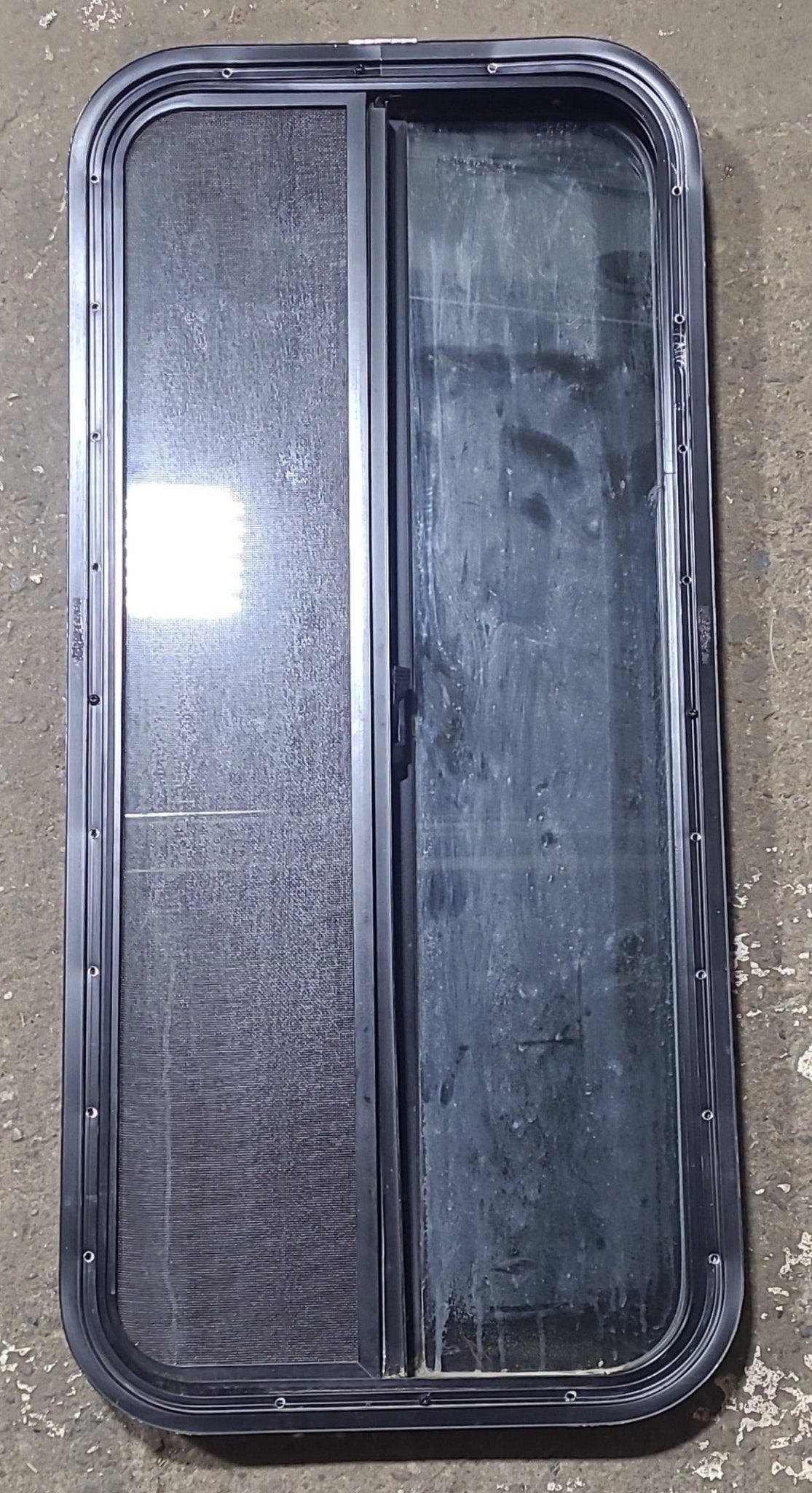 Used Black Radius Opening Window : 17 3/8" W x 39 1/2" H x 1 5/8" D - Young Farts RV Parts