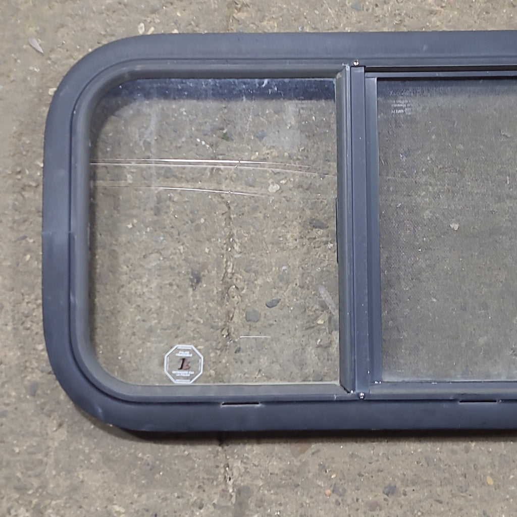 Used Black Radius Opening Window : 23 1/2" W x 14 1/2" H x 1 1/4" D - Young Farts RV Parts