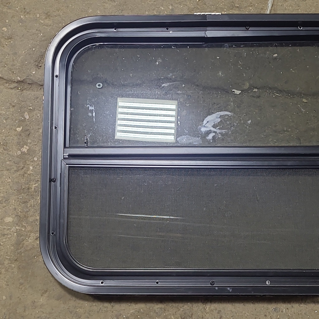 Used Black Radius Opening Window : 23 1/2" W x 19 1/2" H x 1 3/4" D - Young Farts RV Parts