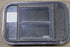 Used Black Radius Opening Window : 23" W x 14 1/8" H x 1 3/4" D - Young Farts RV Parts