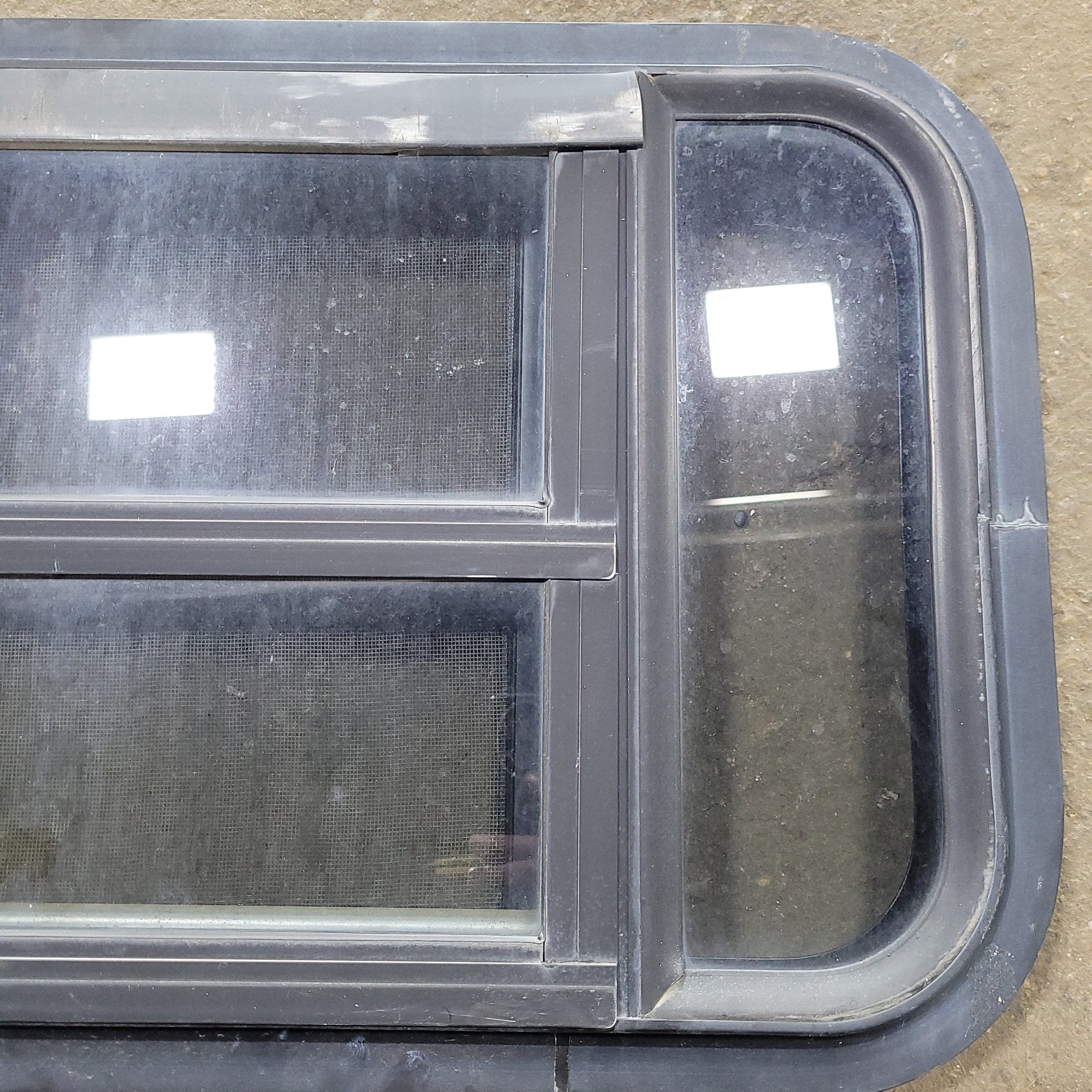 Used Black Radius Opening Window : 23" X 14 1/4" X 1 3/4" D - Young Farts RV Parts