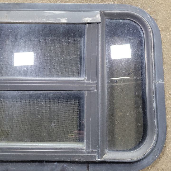 Used Black Radius Opening Window : 23" X 14 1/4" X 1 3/4" D - Young Farts RV Parts