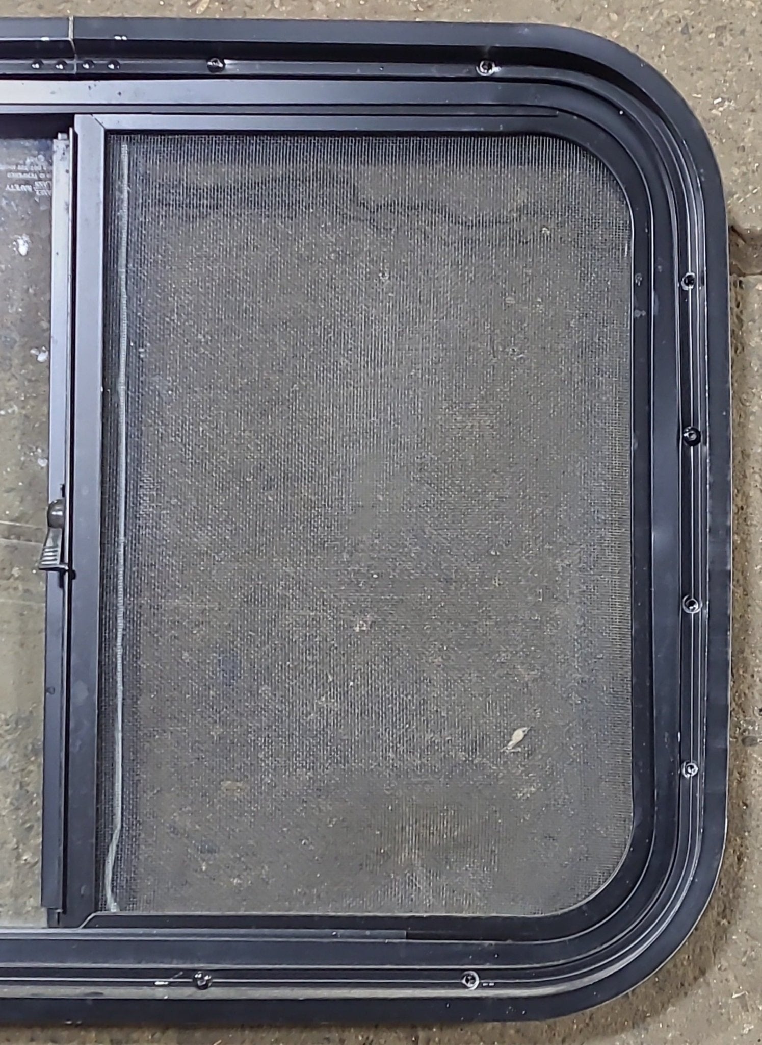 Used Black Radius Opening Window : 24 1/2" W x 17 3/4" H x 1 3/4" D - Young Farts RV Parts