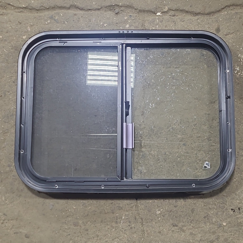 Used Black Radius Opening Window : 24 1/2" W x 18" H x 1 3/4" D - Young Farts RV Parts