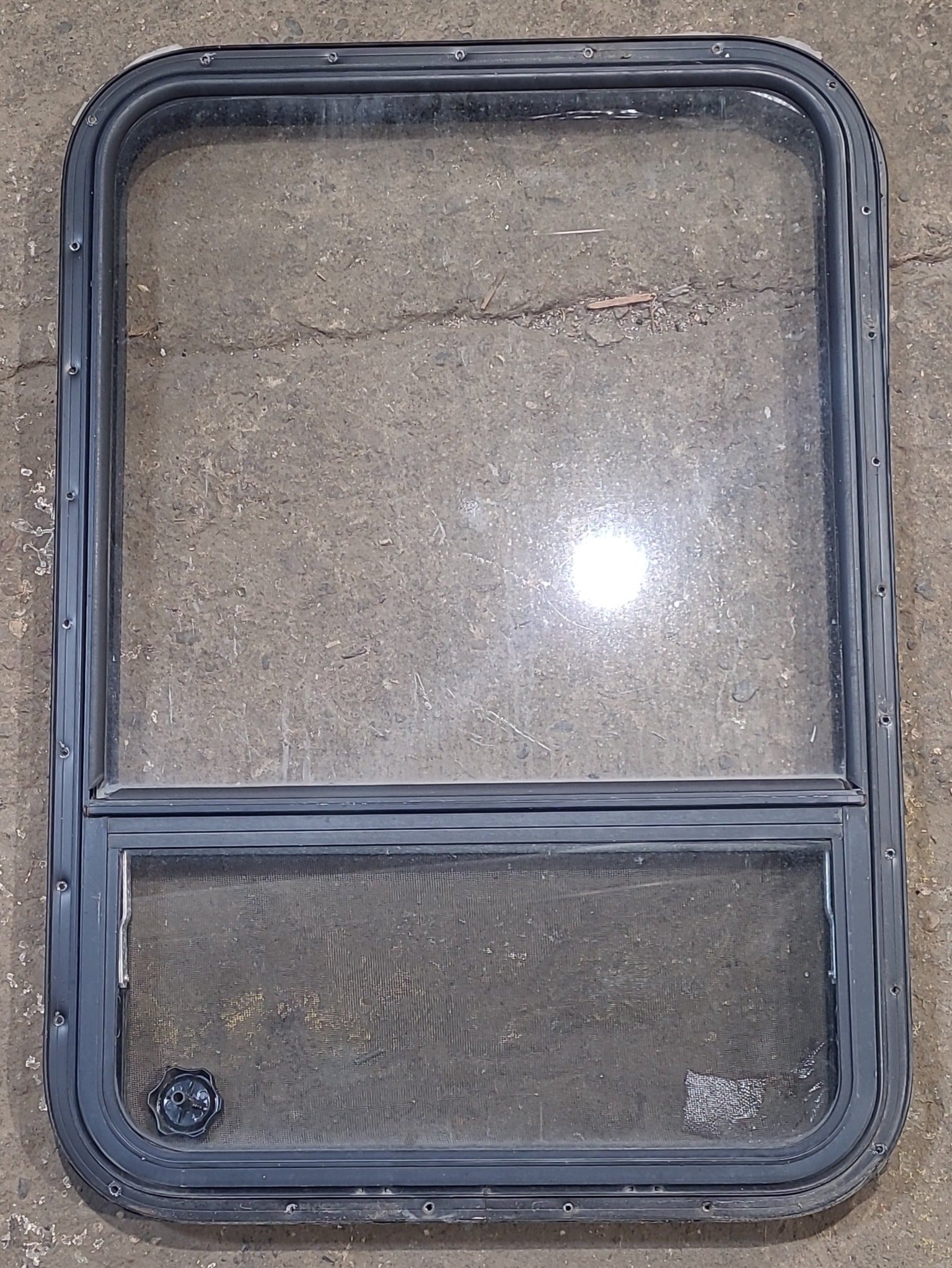 Used Black Radius Opening Window : 24 1/4" W x 35 1/4" H x 1 1/4" D - Young Farts RV Parts