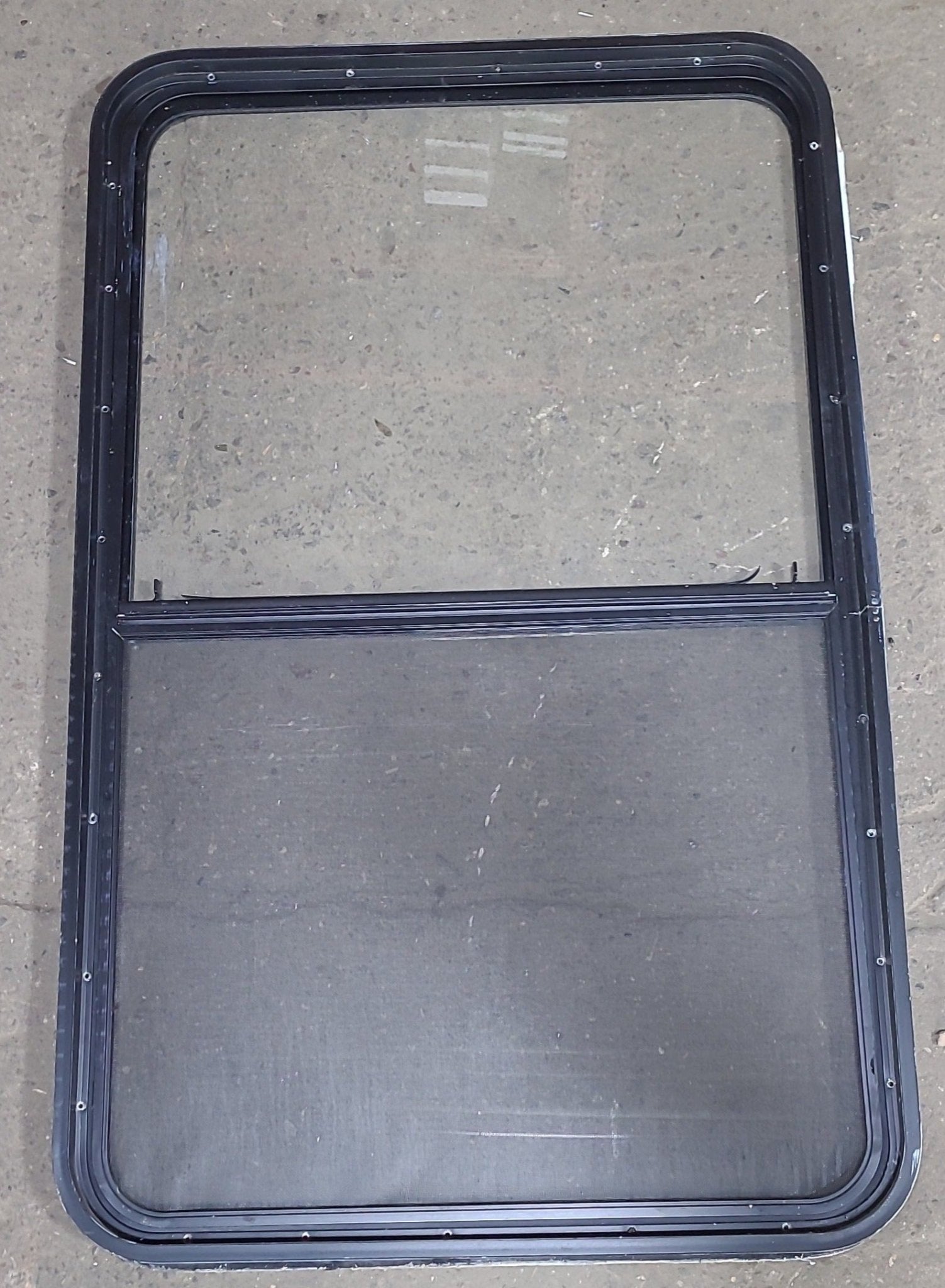 Used Black Radius Opening Window : 29 1/2" W x 47 1/2" H x 1 3/4" D - Young Farts RV Parts