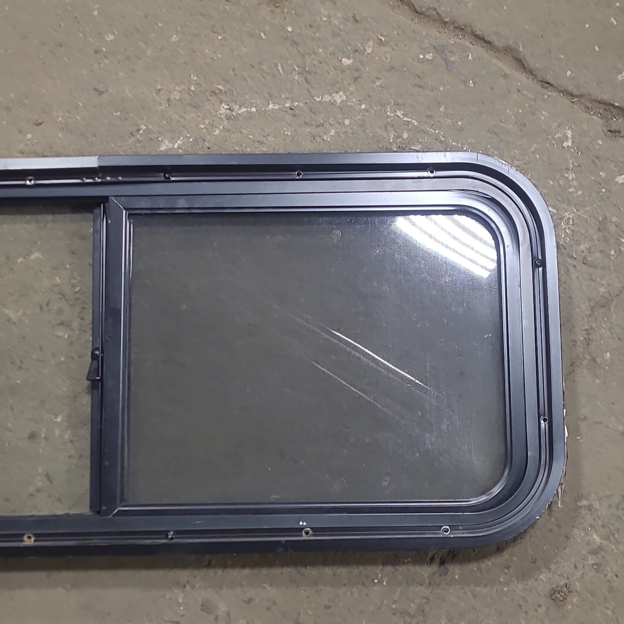 Used Black Radius Opening Window : 36 1/2" W x 14 3/4" H x 1 3/4" D - Young Farts RV Parts