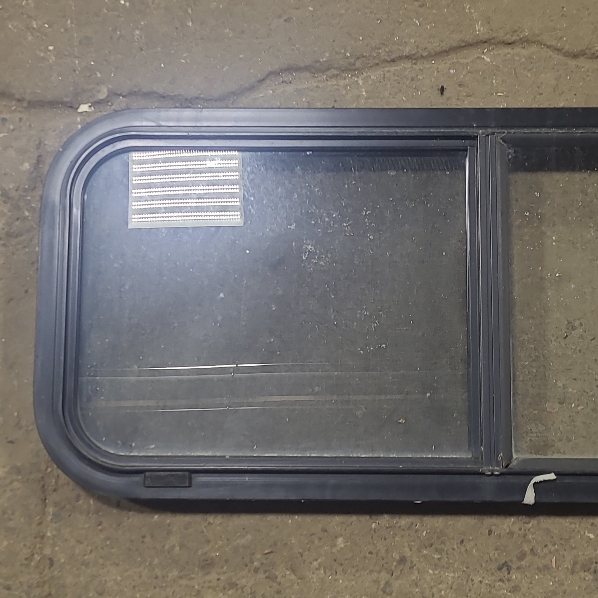 Used Black Radius Opening Window : 36 1/4" W x 14 3/4" H x 1 3/4" D - Young Farts RV Parts