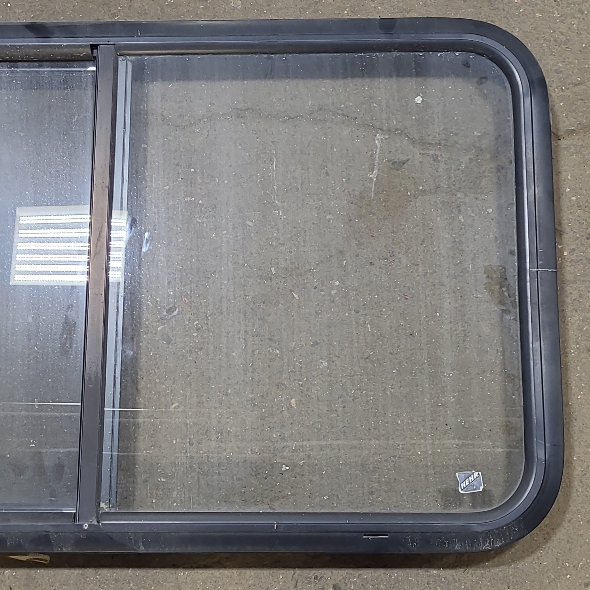 Used Black Radius Opening Window : 36 1/4" W X 21 3/4" H X 1 3/4" D - Young Farts RV Parts