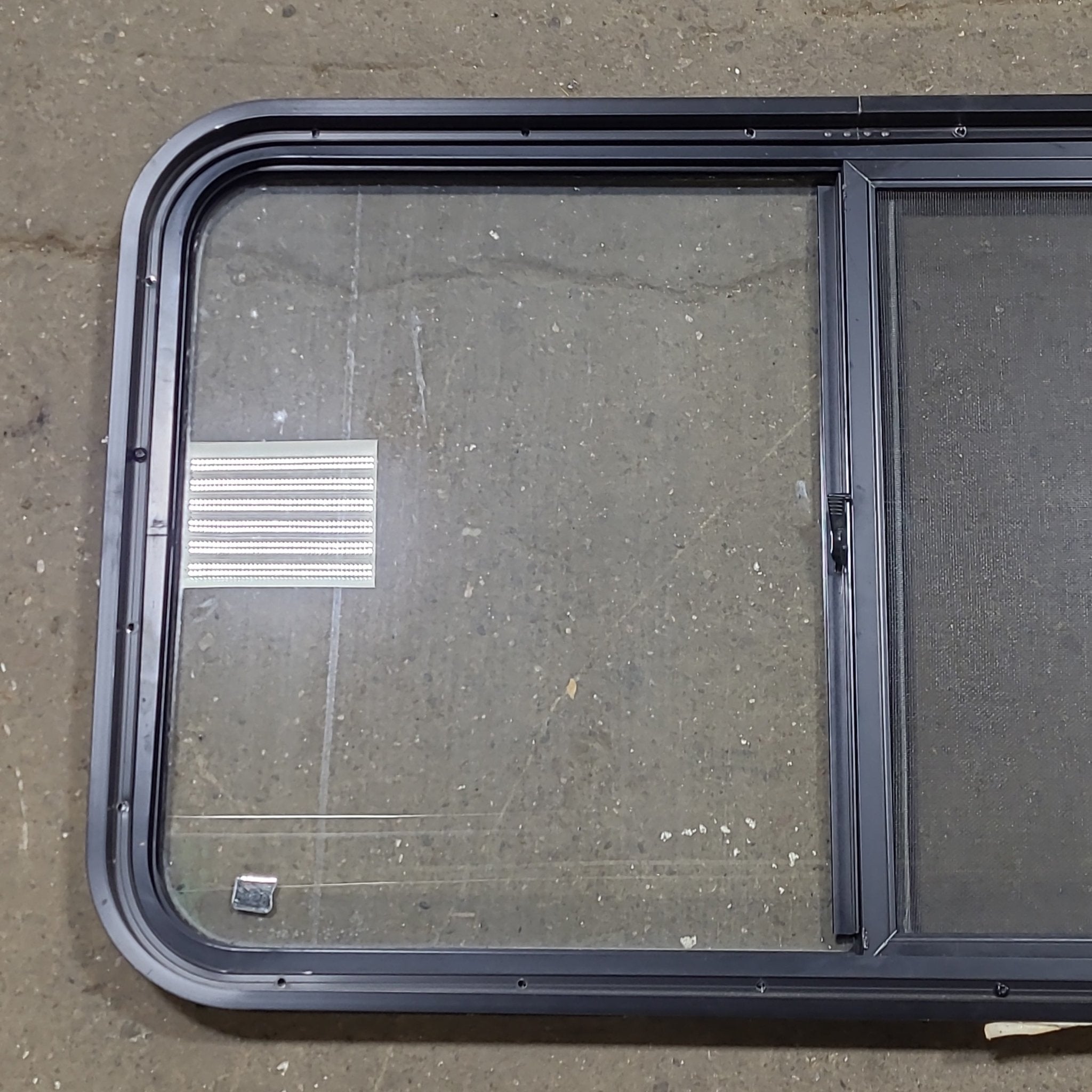 Used Black Radius Opening Window : 36 1/4" W X 21 3/4" H X 1 3/4" D - Young Farts RV Parts