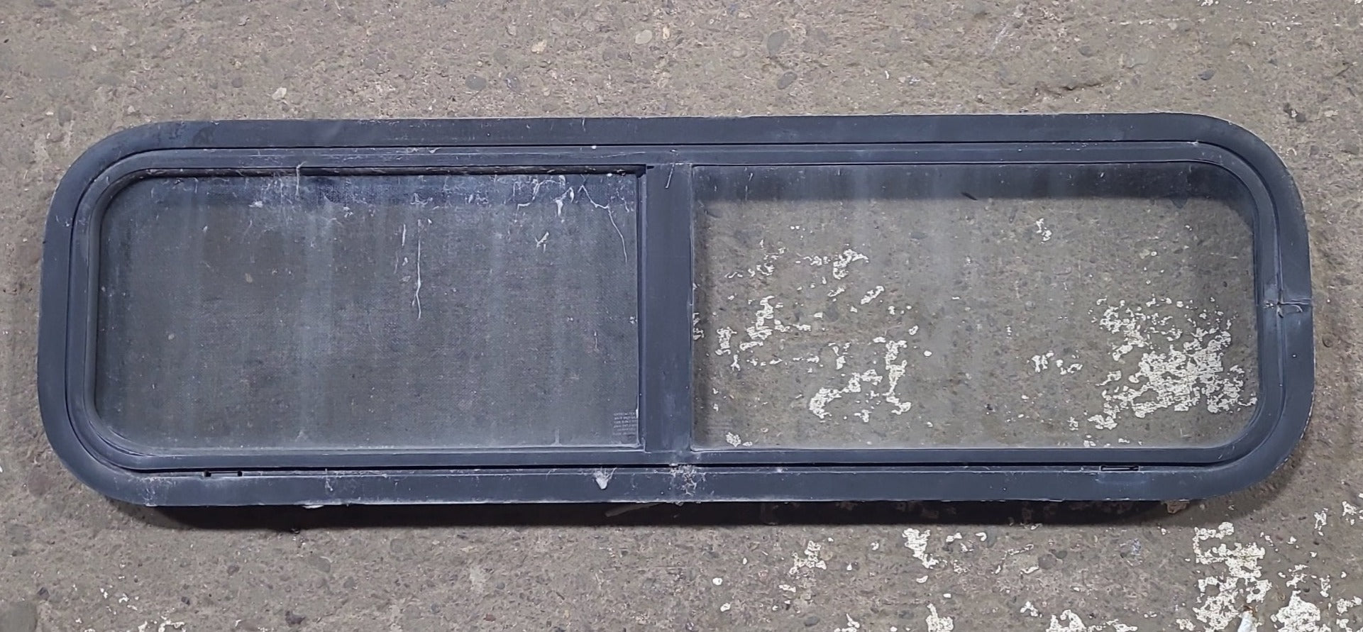 Used Black Radius Opening Window : 42 1/4" W x 11 3/4" H x 1 7/8" D - Young Farts RV Parts