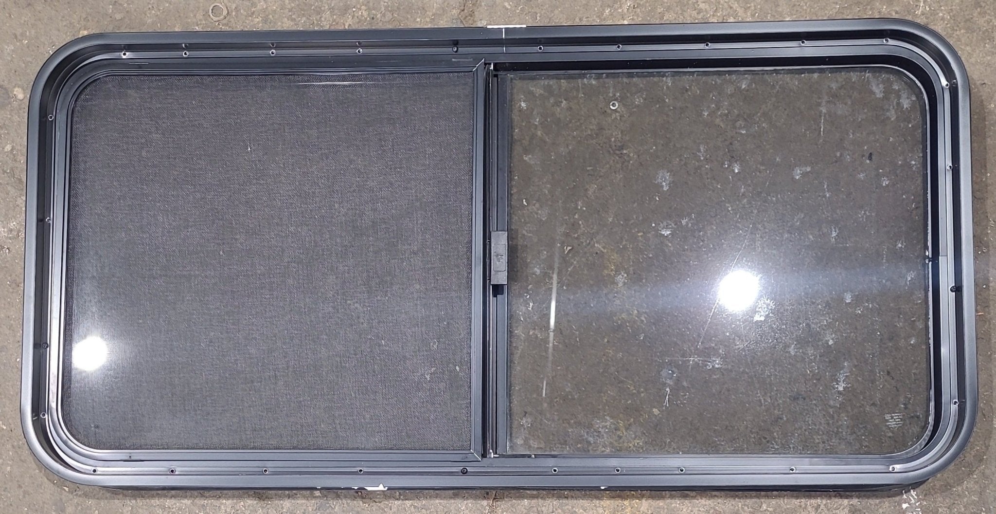 Used Black Radius Opening Window : 45 1/2" W x 21 1/2" H x 1 3/4" D - Young Farts RV Parts