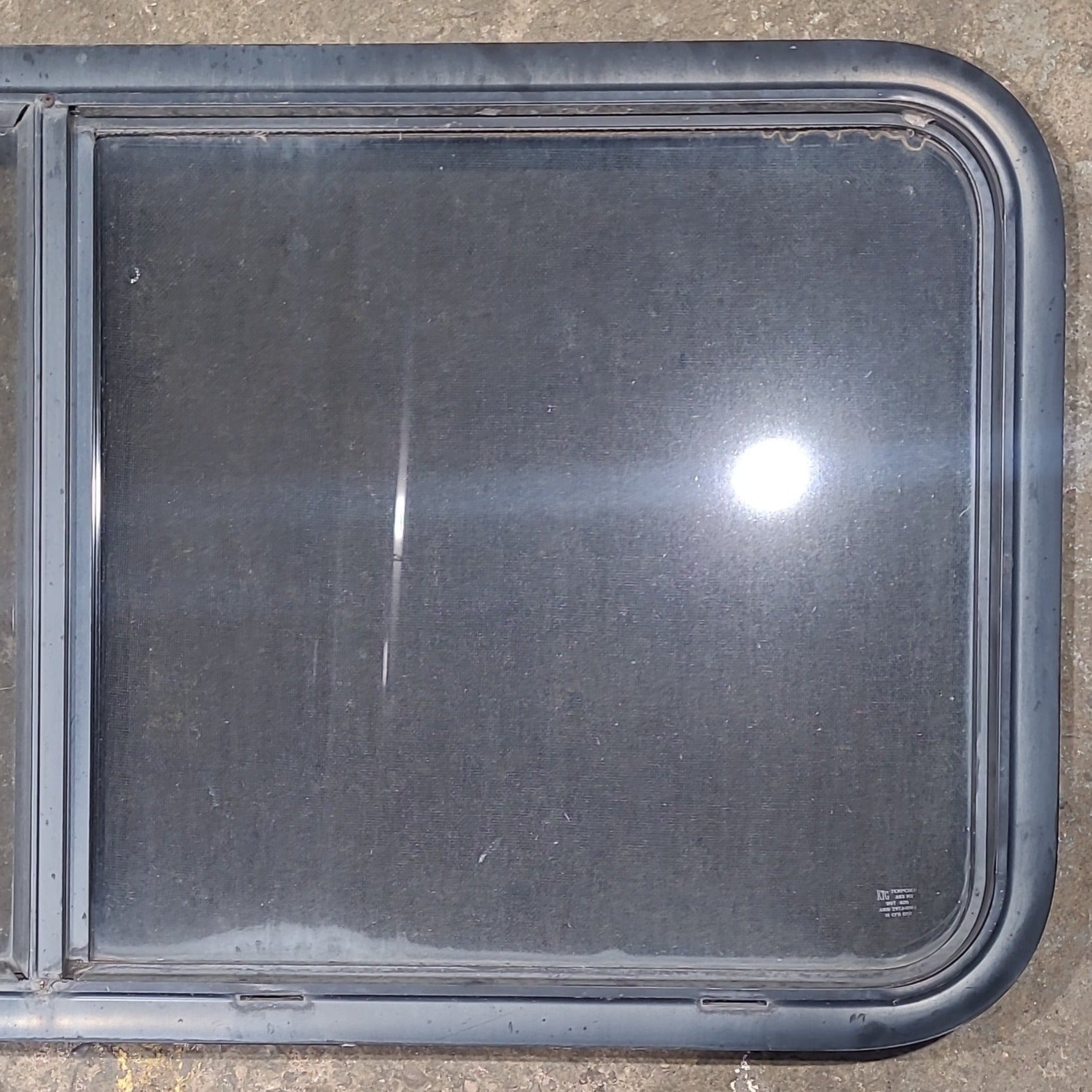 Used Black Radius Opening Window : 45 1/2" W x 21 1/2" H x 1 3/4" D - Young Farts RV Parts