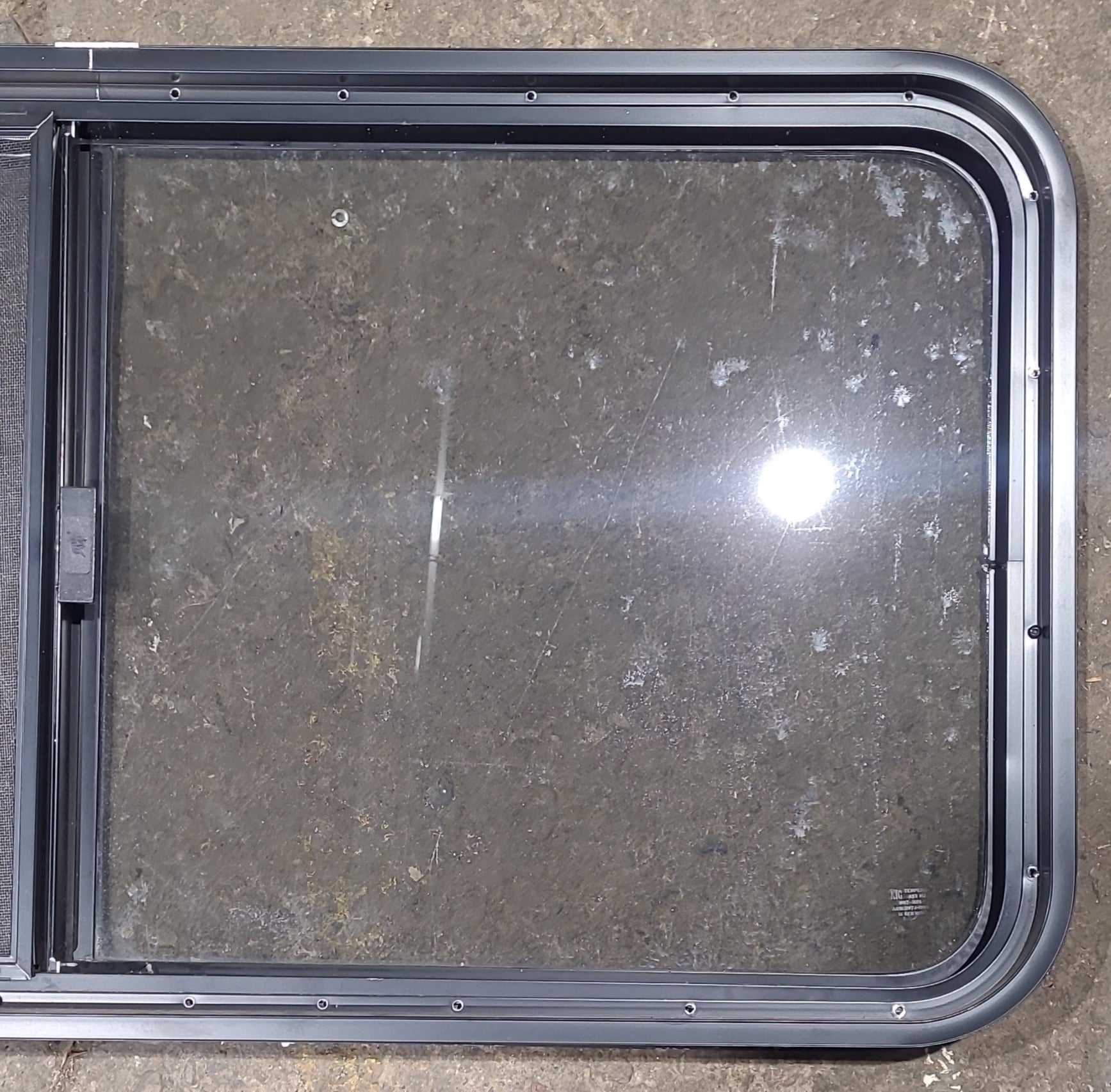 Used Black Radius Opening Window : 45 1/2" W x 21 1/2" H x 1 3/4" D - Young Farts RV Parts