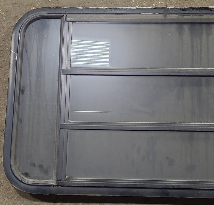 Used Black Radius Opening Window : 45 3/8" W x 22 1/2" H x 1 3/4" D - Young Farts RV Parts