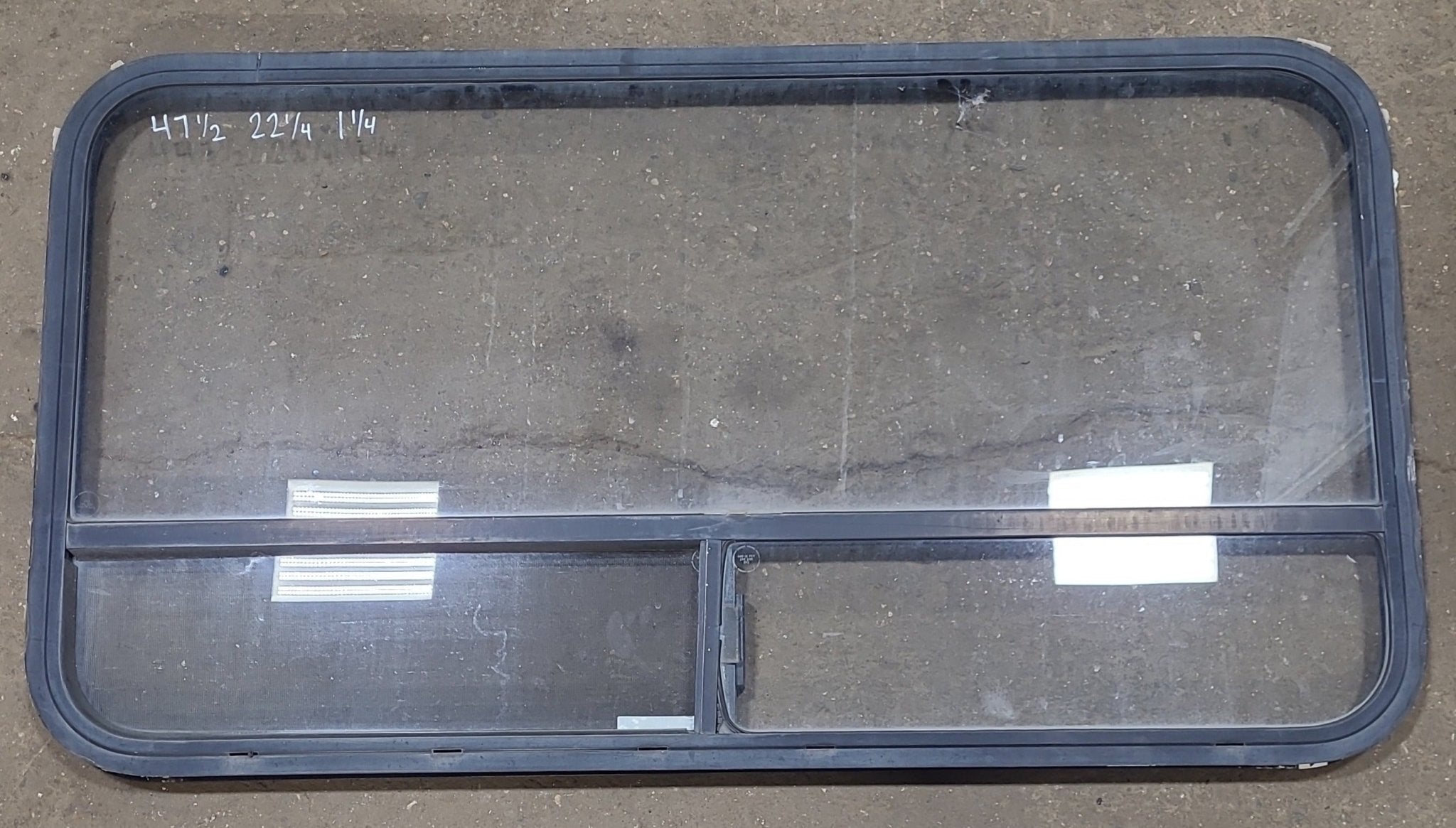 Used Black Radius Opening Window : 47 1/2" W x 22 1/4" H x 1 1/4" D - Young Farts RV Parts