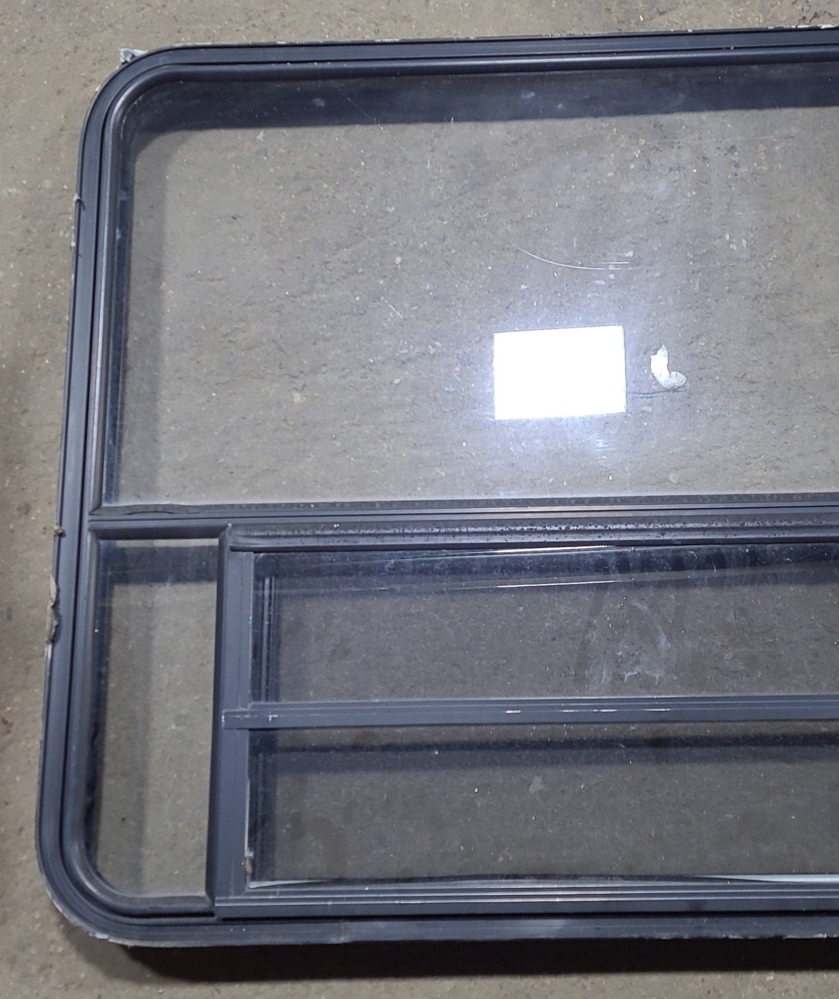 Used Black Radius Opening Window : 47 1/4" W x 35 1/2" H x 2" D - Young Farts RV Parts