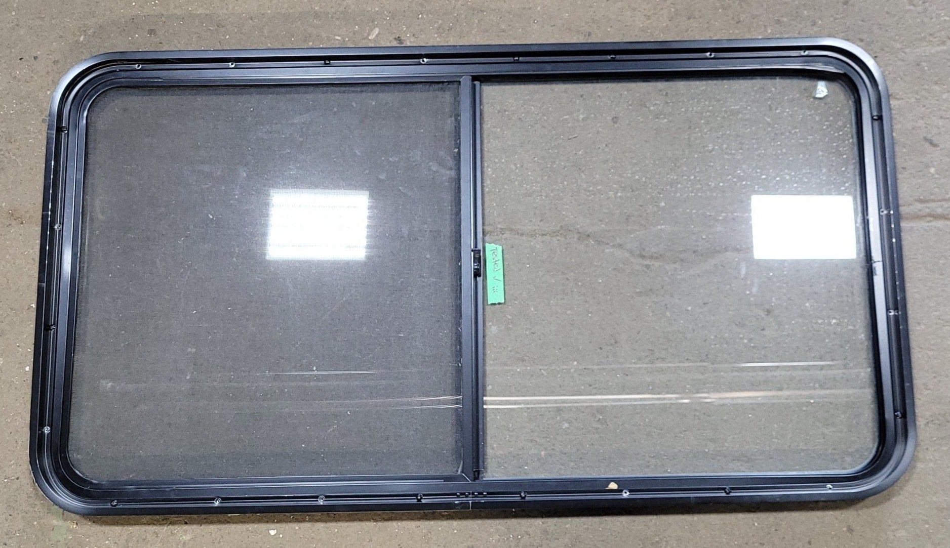 Used Black Radius Opening Window : 48 1/2" W X 25 3/4" H X 2" D - Young Farts RV Parts