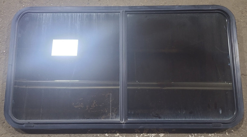 Used Black Radius Opening Window : 48 1/2" W x 261/4" H x 1 3/4" D - Young Farts RV Parts